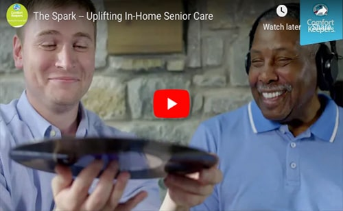 Staff and resident enjoying music together