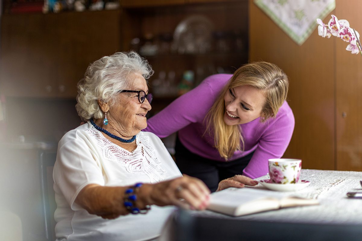 Caregiver interacting with senior resident