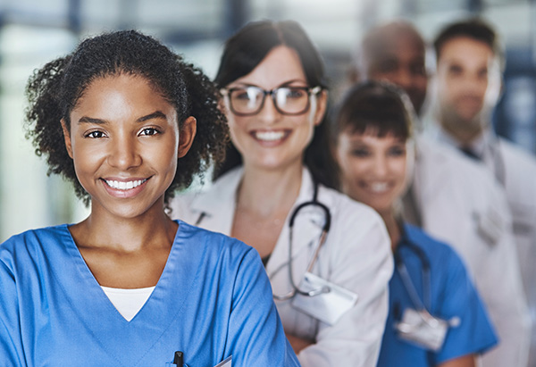 Smiling healthcare professionals in scrubs