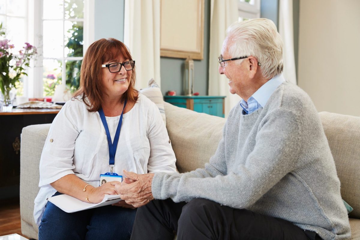 Staff member engaged in conversation with resident.