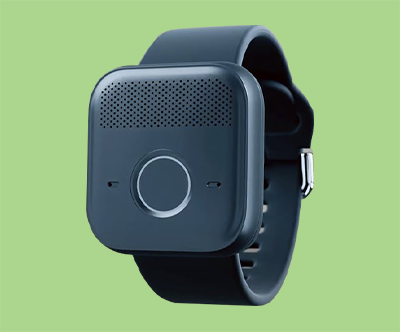 Close-up of a smartwatch on a green background.