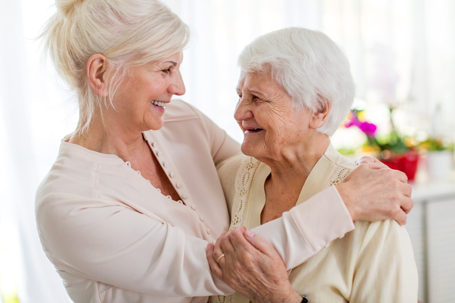 Staff member joyfully interacting with resident