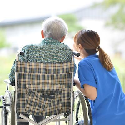 Senior resident and caregiver enjoying the outdoors