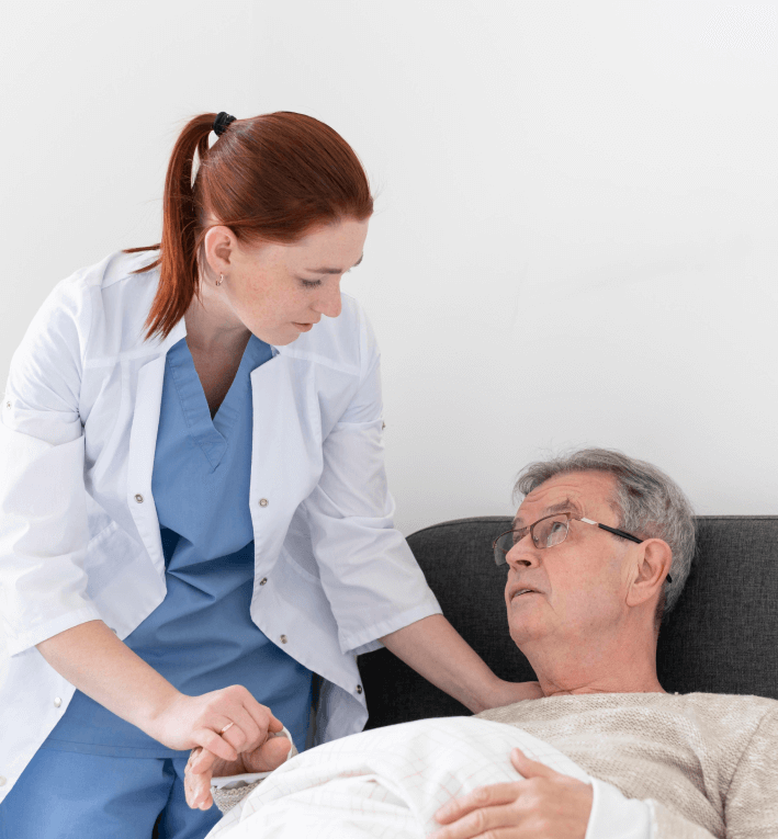 Nurse assisting a resident in a comfortable setting