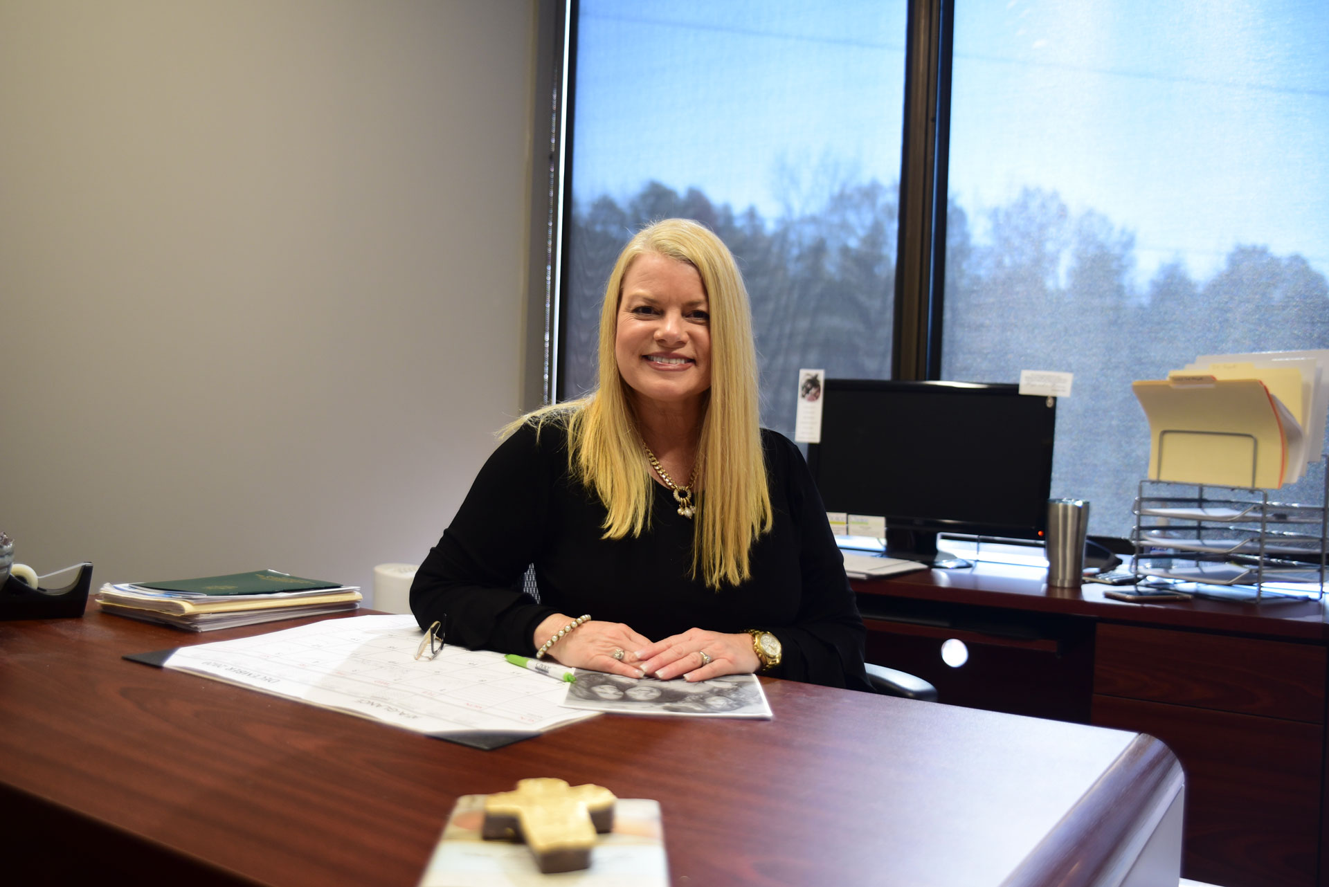 Facility staff member at her desk