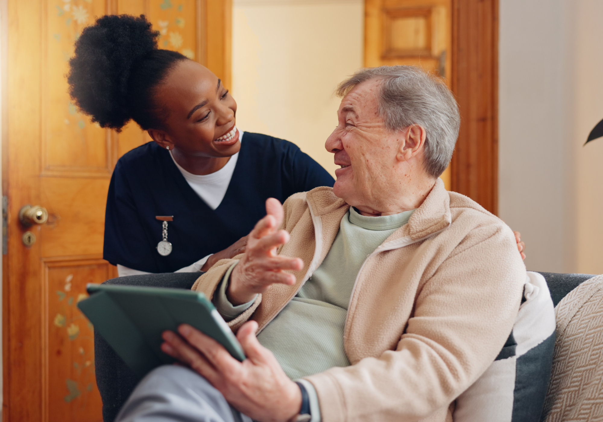 Caregiver interacting happily with resident.