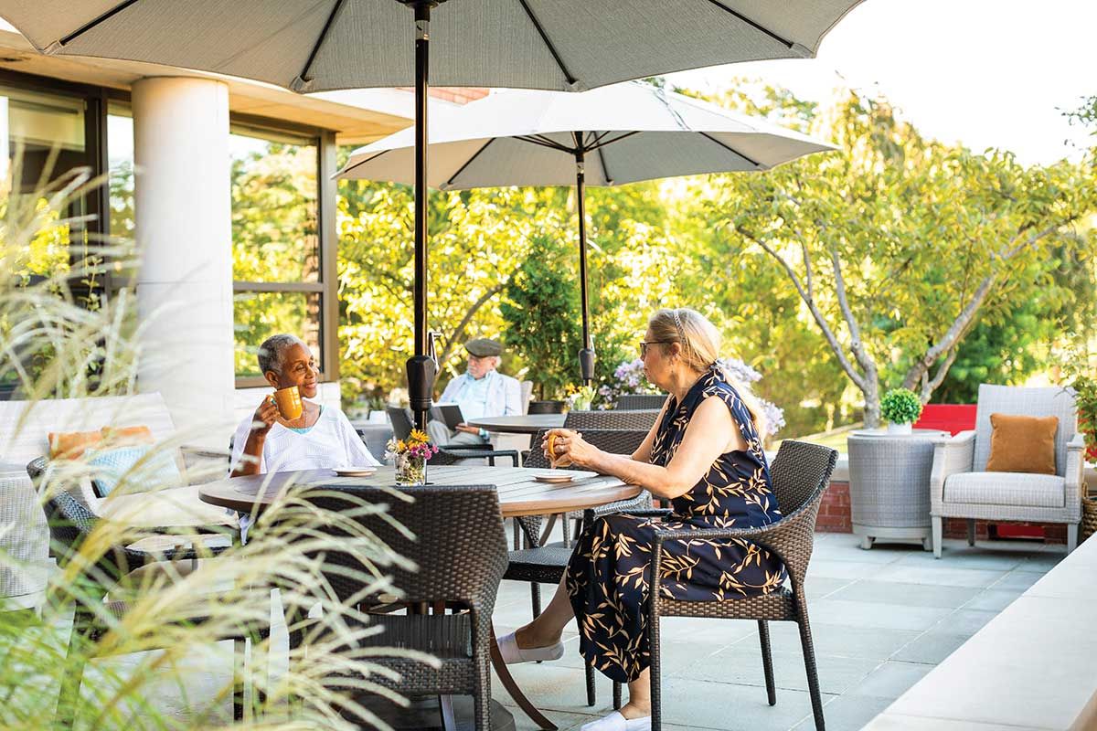 Residents enjoying time outdoors on a patio