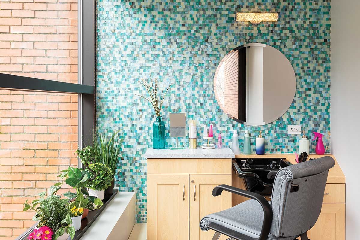 Salon area with colorful tile and plants