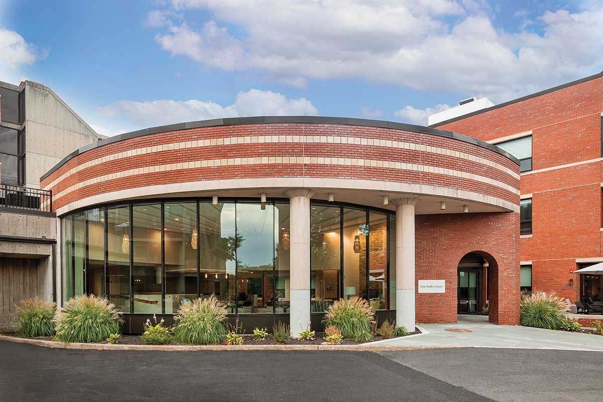 Modern building entrance with large glass windows.