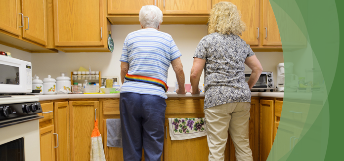 Two residents in a kitchen setting.