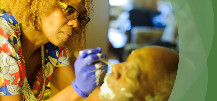 Caregiver assisting a senior with grooming