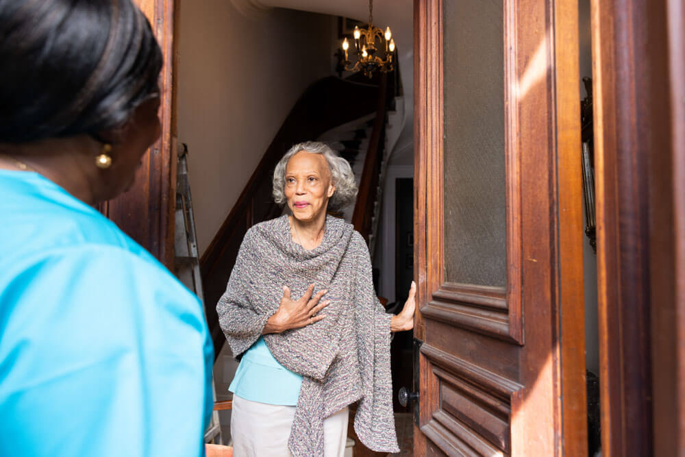 Resident greeting staff in a common area