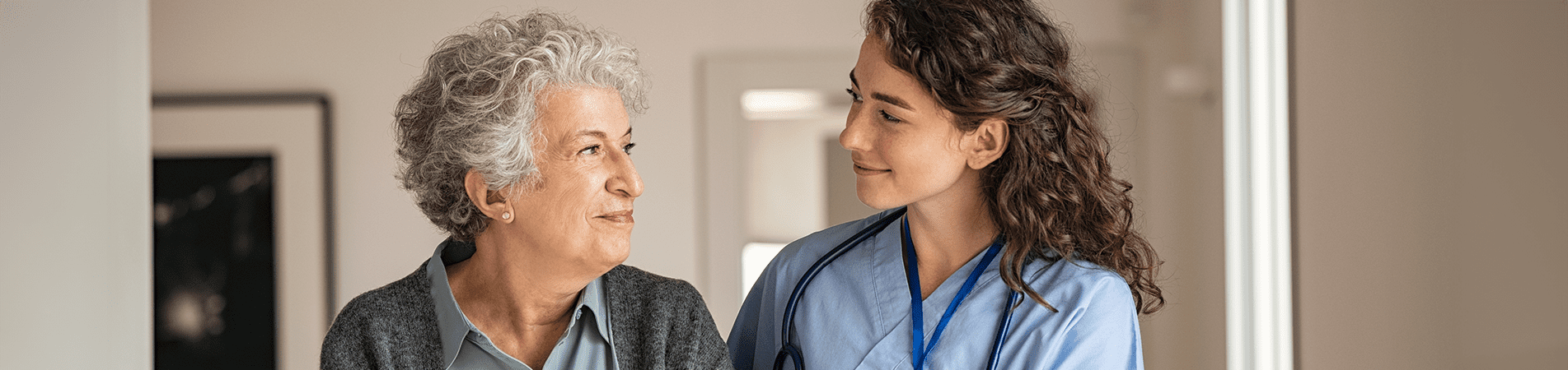 Caregiver interacting with senior resident