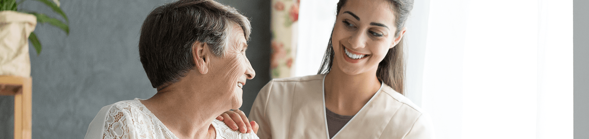 Caregiver interacting with senior resident