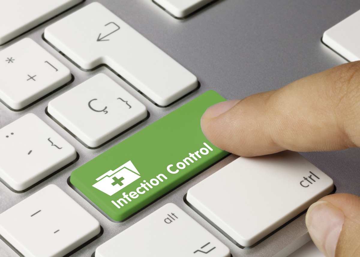 Close-up of a keyboard key labeled 'Infection Control'.