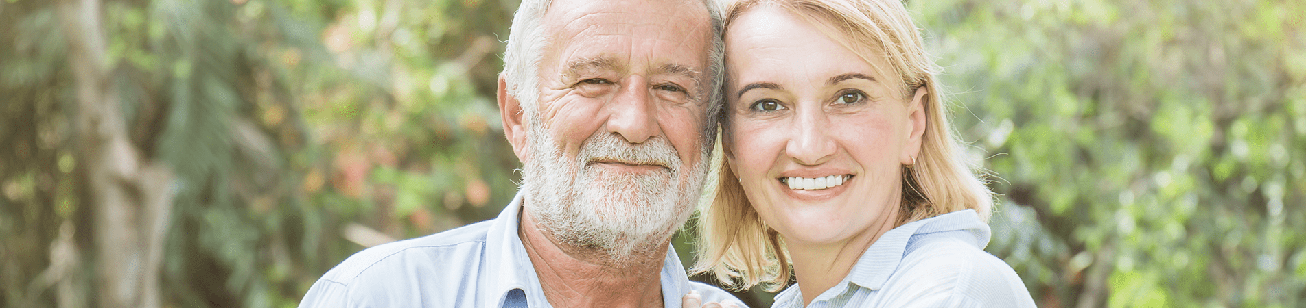 Smiling older man and woman outdoors
