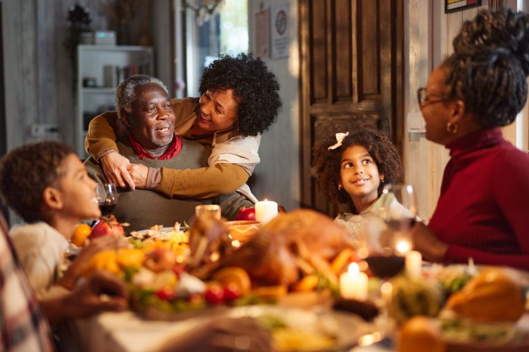 Family gathering around a festive dinner table