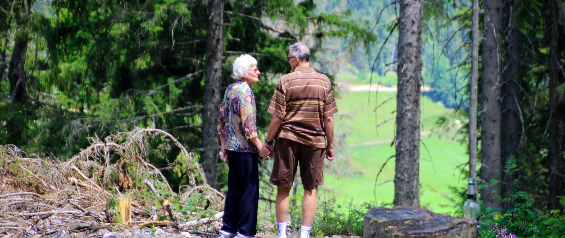Couple enjoying a walk in the woods.