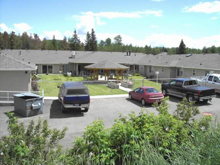 Outdoor view of a senior care facility with parking.