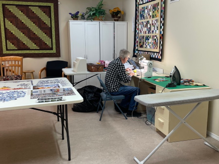 Resident engaging in a quilting activity.