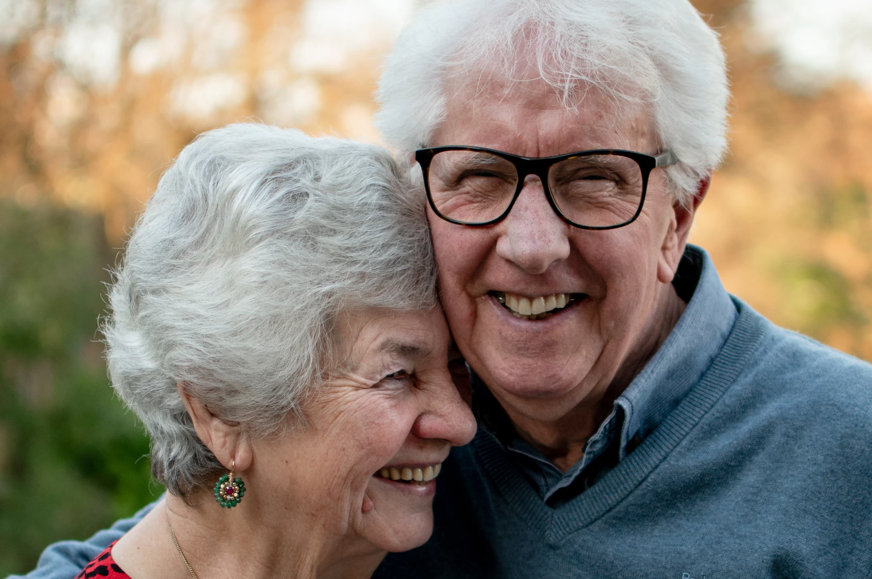 Happy elderly couple smiling together outdoors