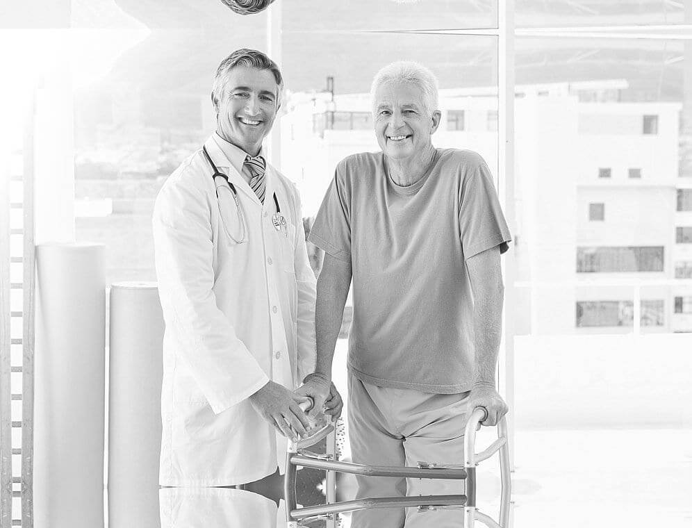 Doctor with resident in a facility setting