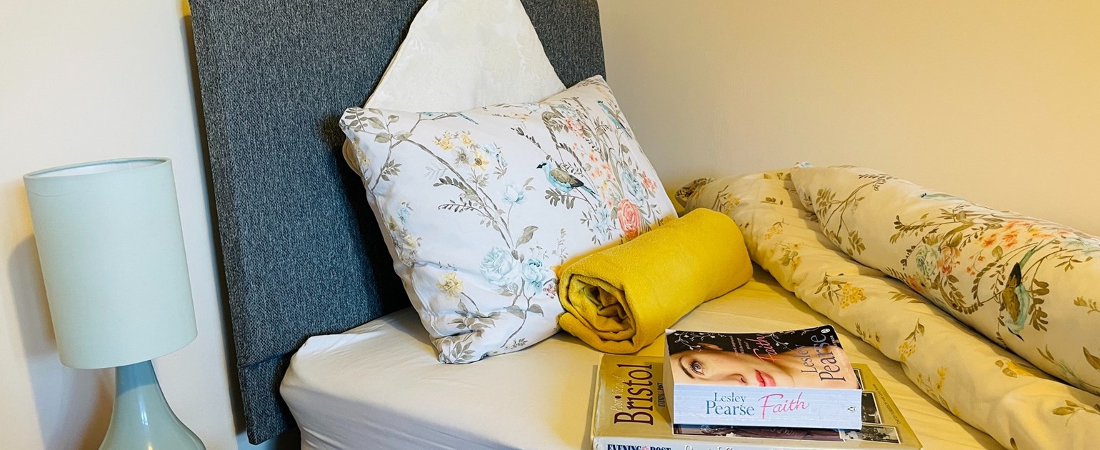 Cozy bedroom setup with floral bedding