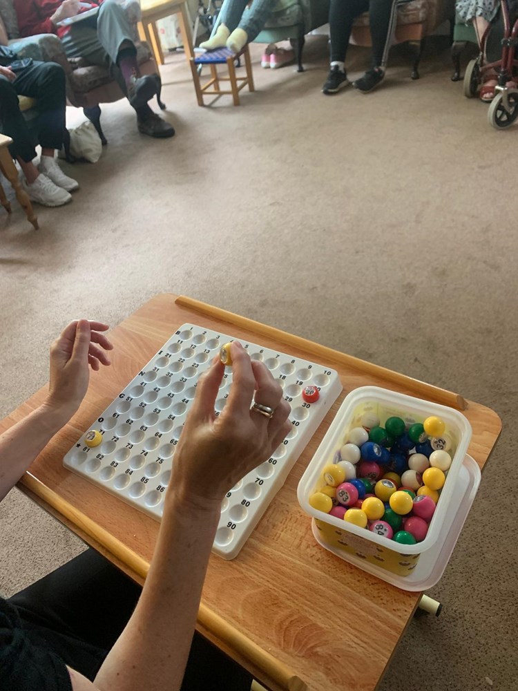 Residents participating in a bingo game activity.