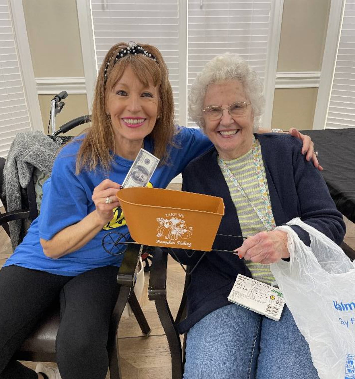 Staff member and resident enjoying a social activity.