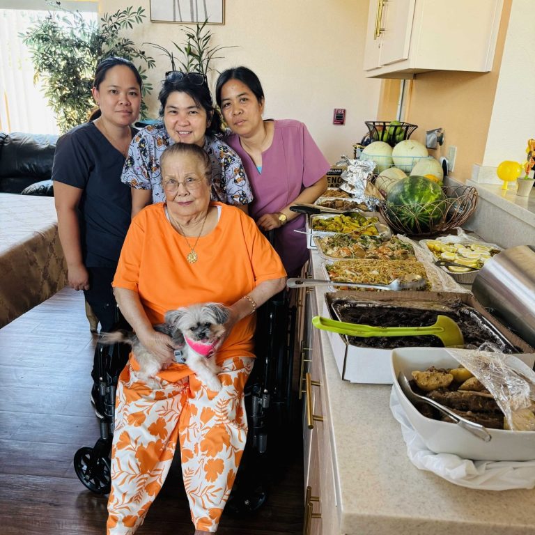 Residents and staff enjoying a meal together