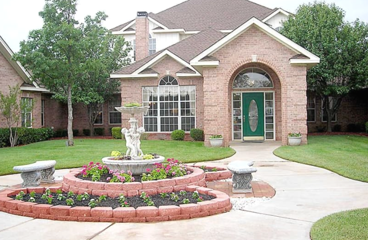 Outdoor area with landscaping and building entrance