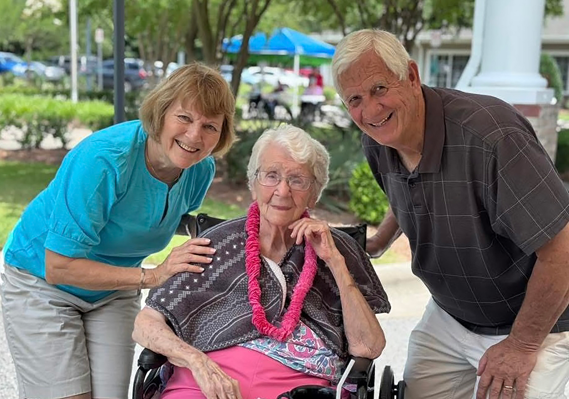 Three residents enjoying time outdoors together.
