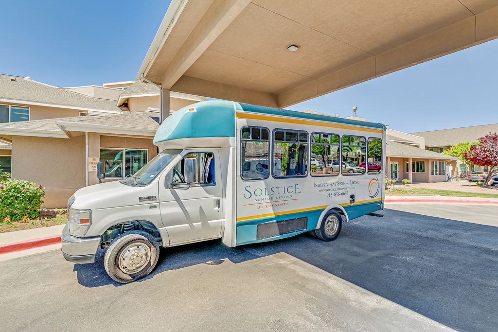 Facility shuttle bus in front of the building