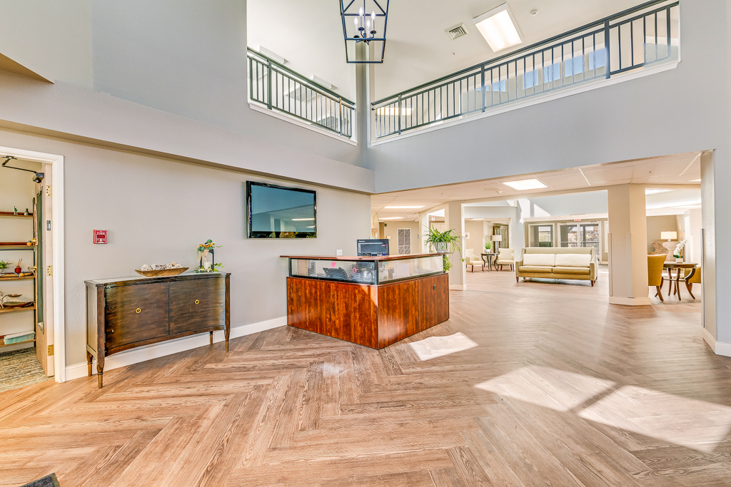 Bright common area with seating and reception desk
