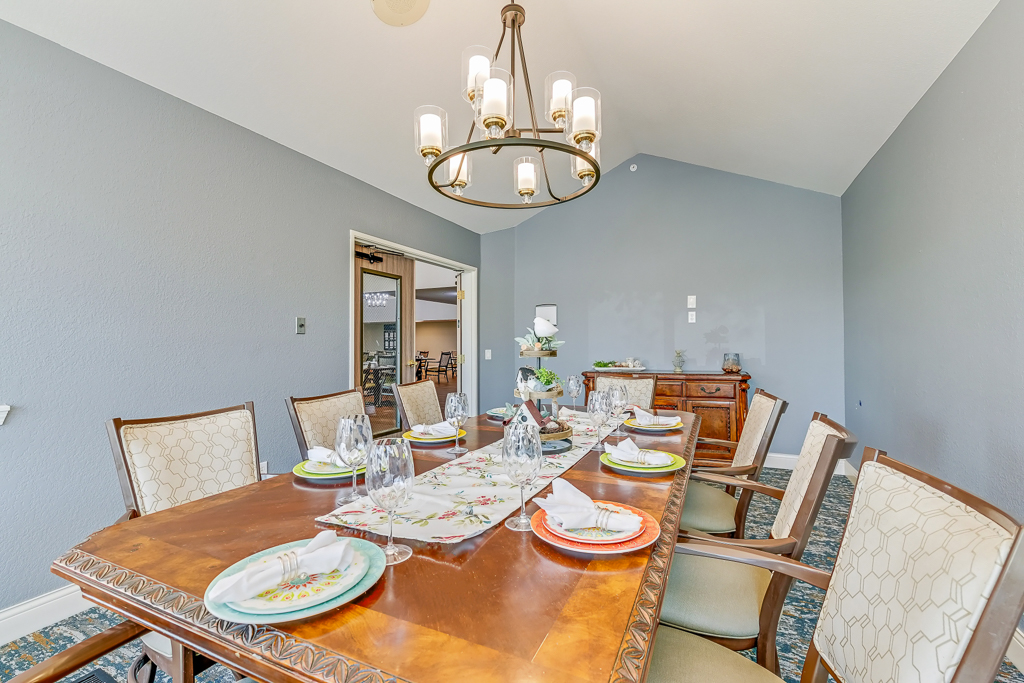 Elegant dining room set for a meal with floral accents