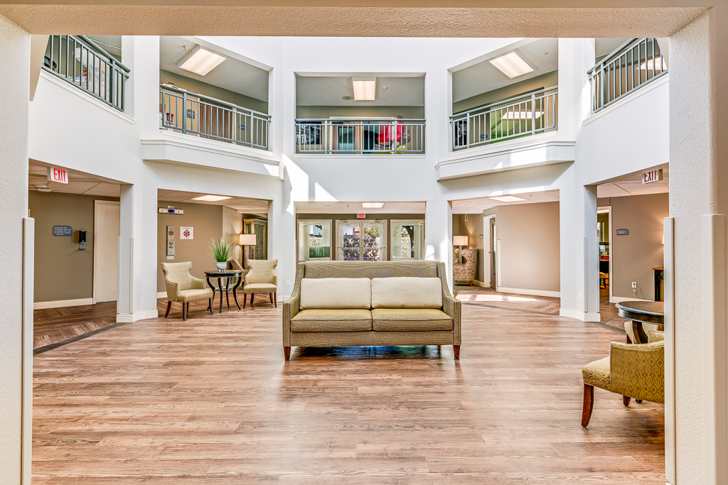 Bright common area with seating in a senior living facility