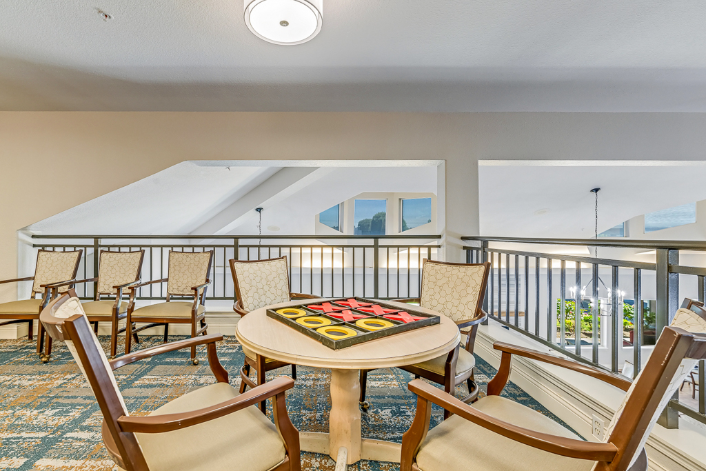 Common area with chairs and a game table