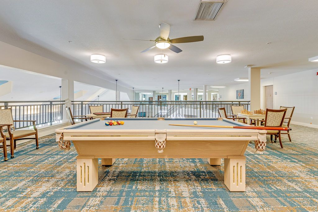 Interior view of a recreational room with a pool table