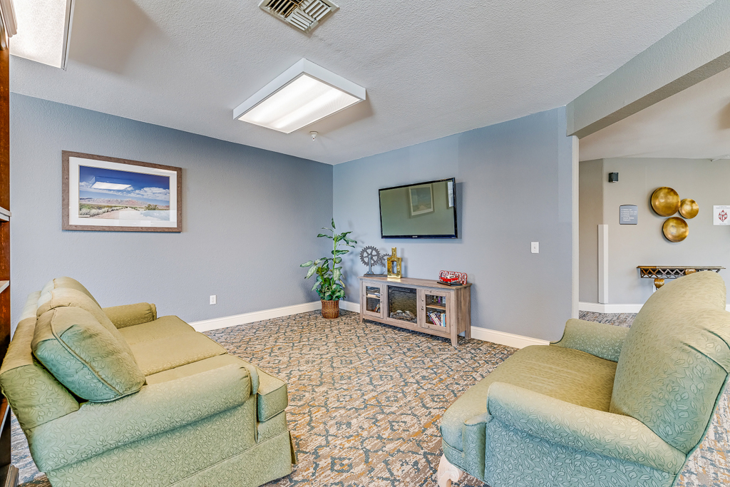 Interior common area with seating and television