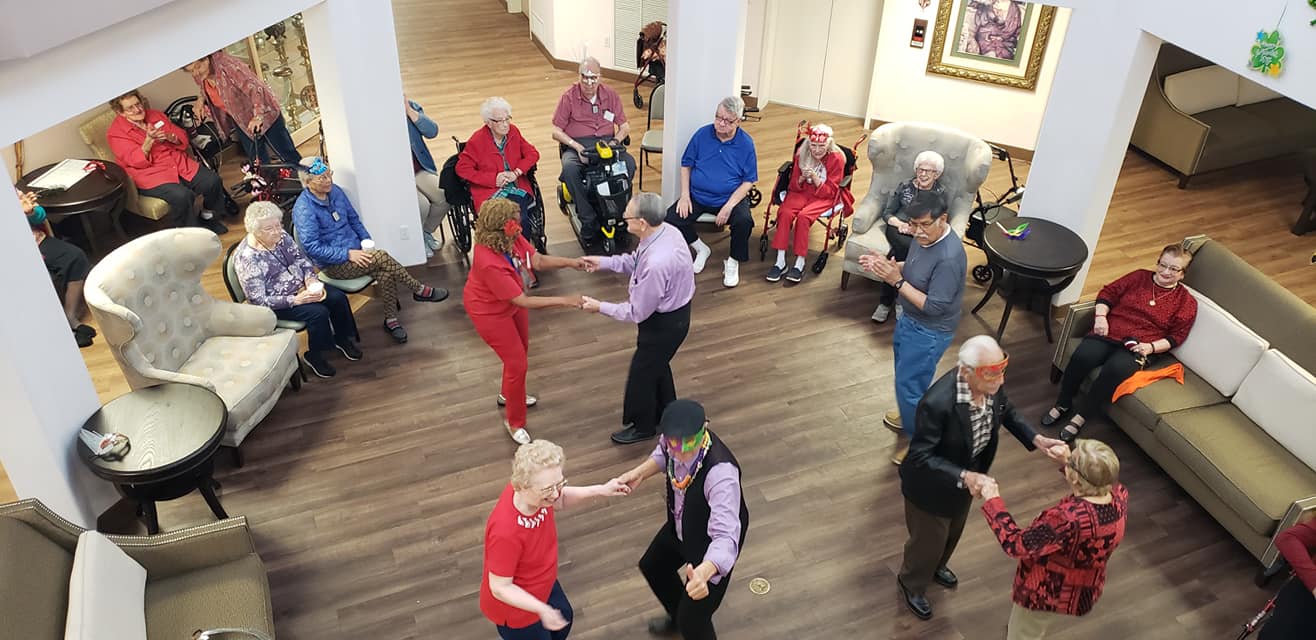 Residents dancing during an activity in a common area