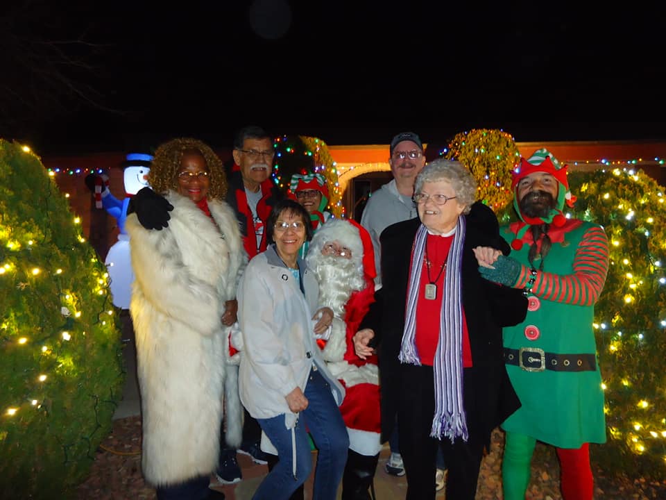 Residents and staff celebrating a festive event outdoors
