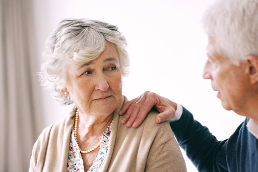Elderly couple in a caring conversation