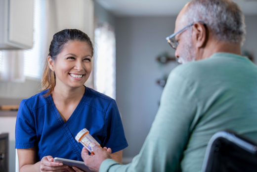 Caregiver interacting with a resident in a cozy setting