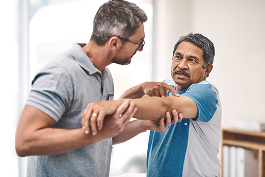 Staff assisting a resident in a therapy session