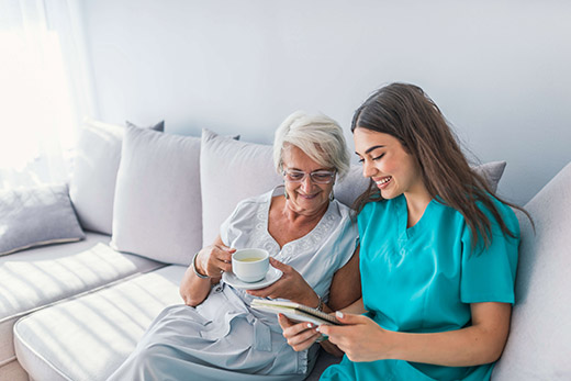 A caregiver and resident enjoying a moment together