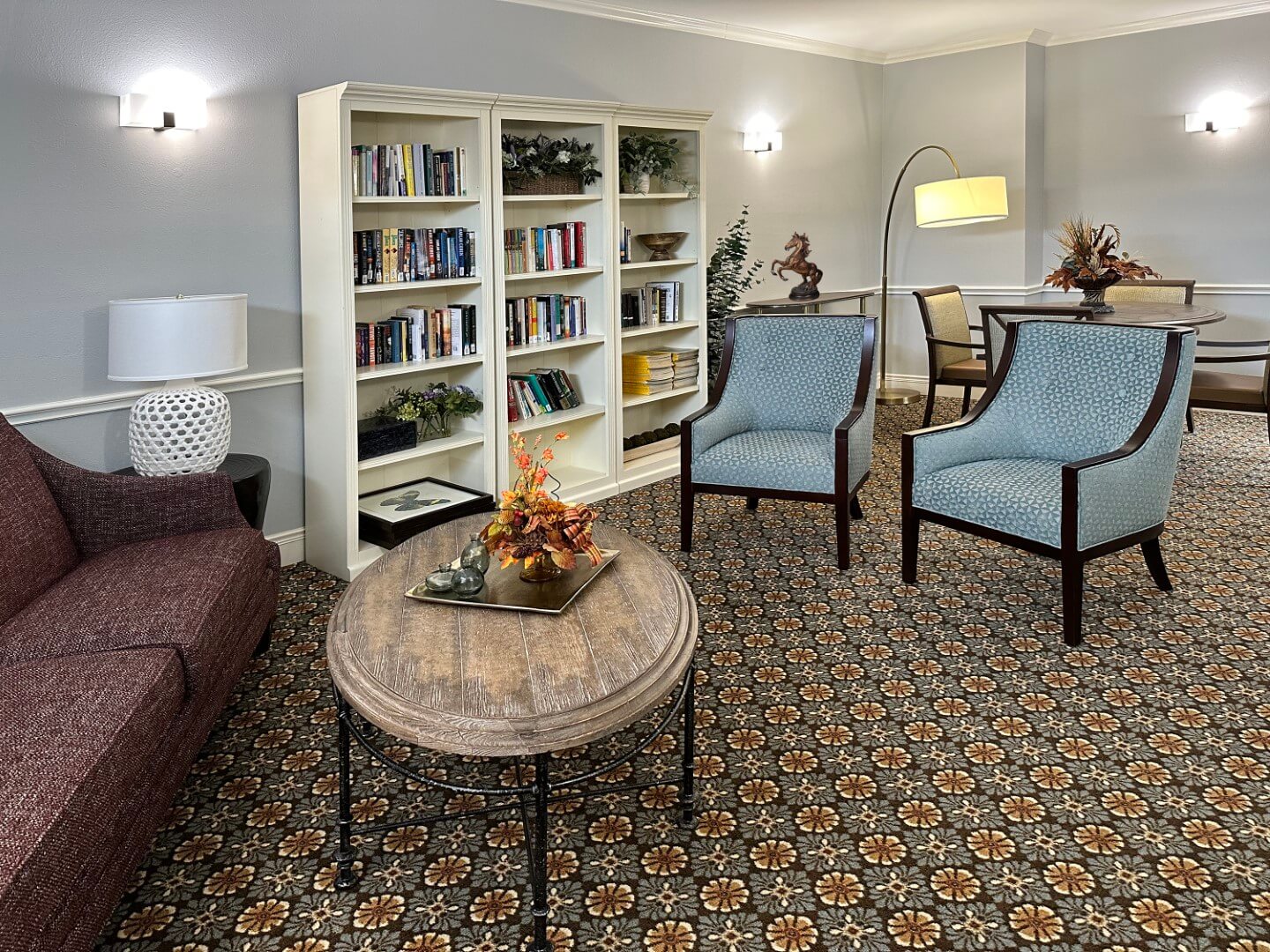 Cozy common area with bookshelves and seating