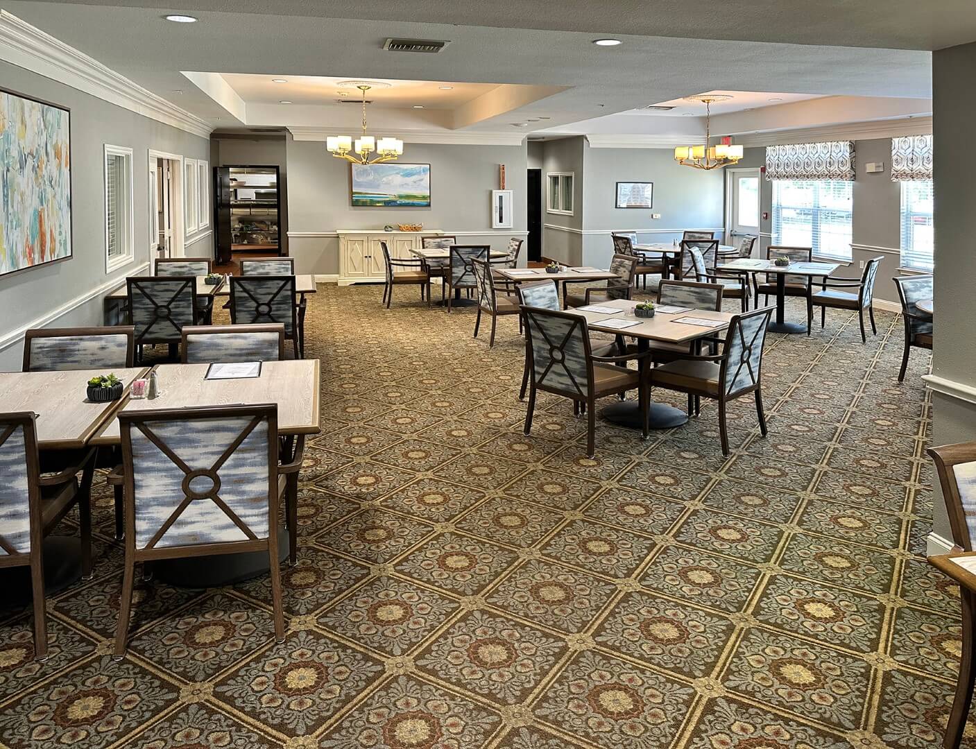 Dining area with tables set for residents