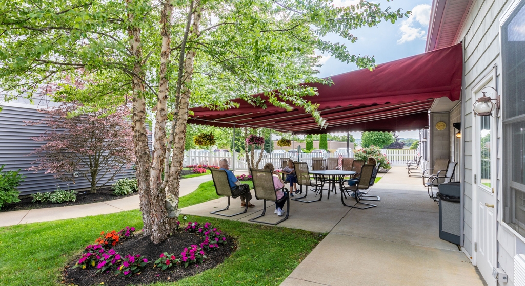 Residents enjoying the outdoor space under shade