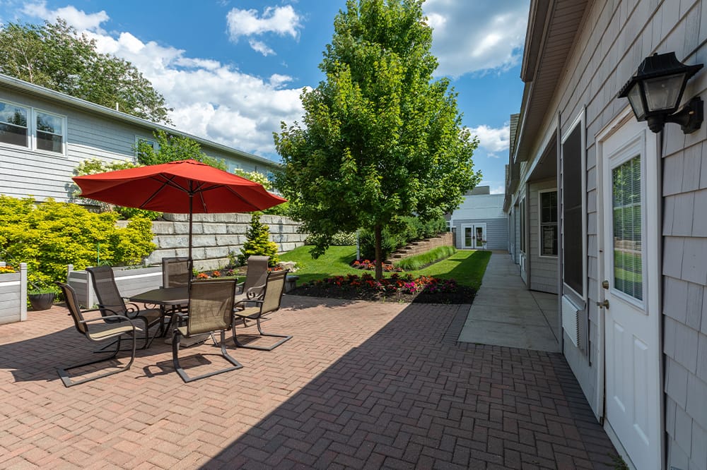 Outdoor patio area with seating and garden