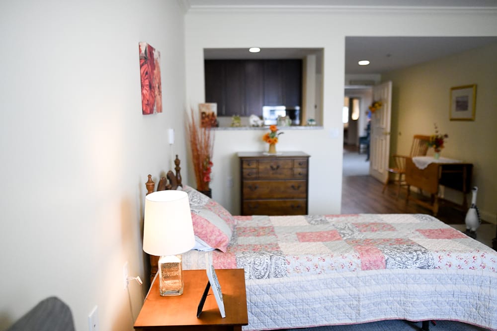 Cozy resident room with a bed and dresser